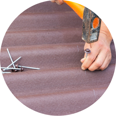 Person using hammer to install carpet flooring with tack strips and tools