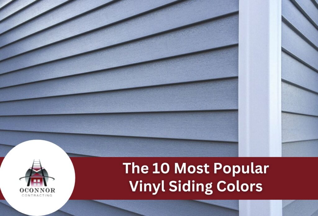 Blue vinyl siding on house exterior with white corner trim and contracting logo