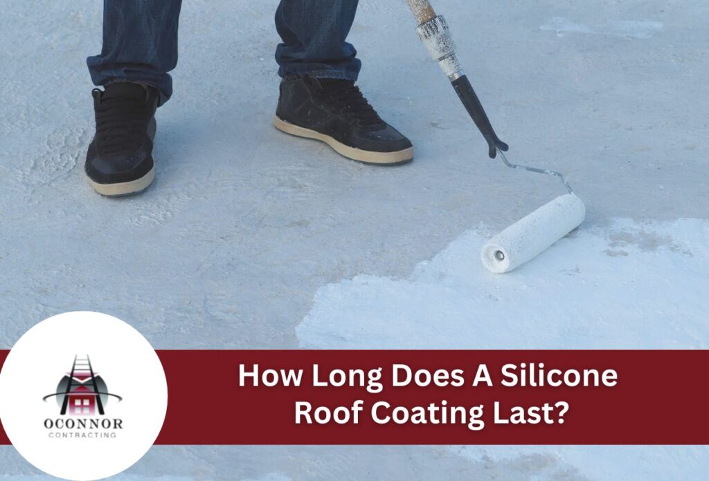 Person applying white silicone roof coating with paint roller on flat roof surface