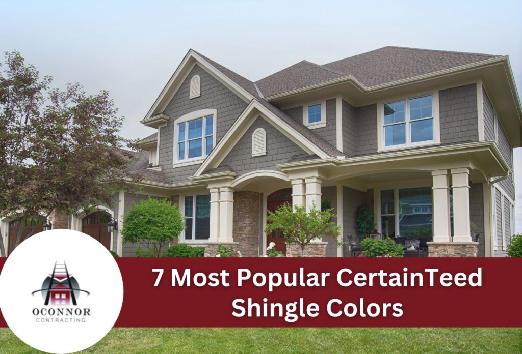 Two-story gray shingle home with stone accents and covered front porch