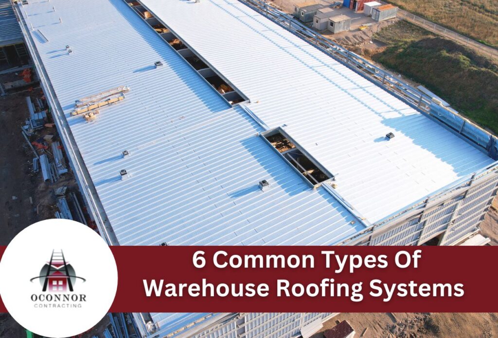 Aerial view of warehouse construction with metal roofing systems and steel framework
