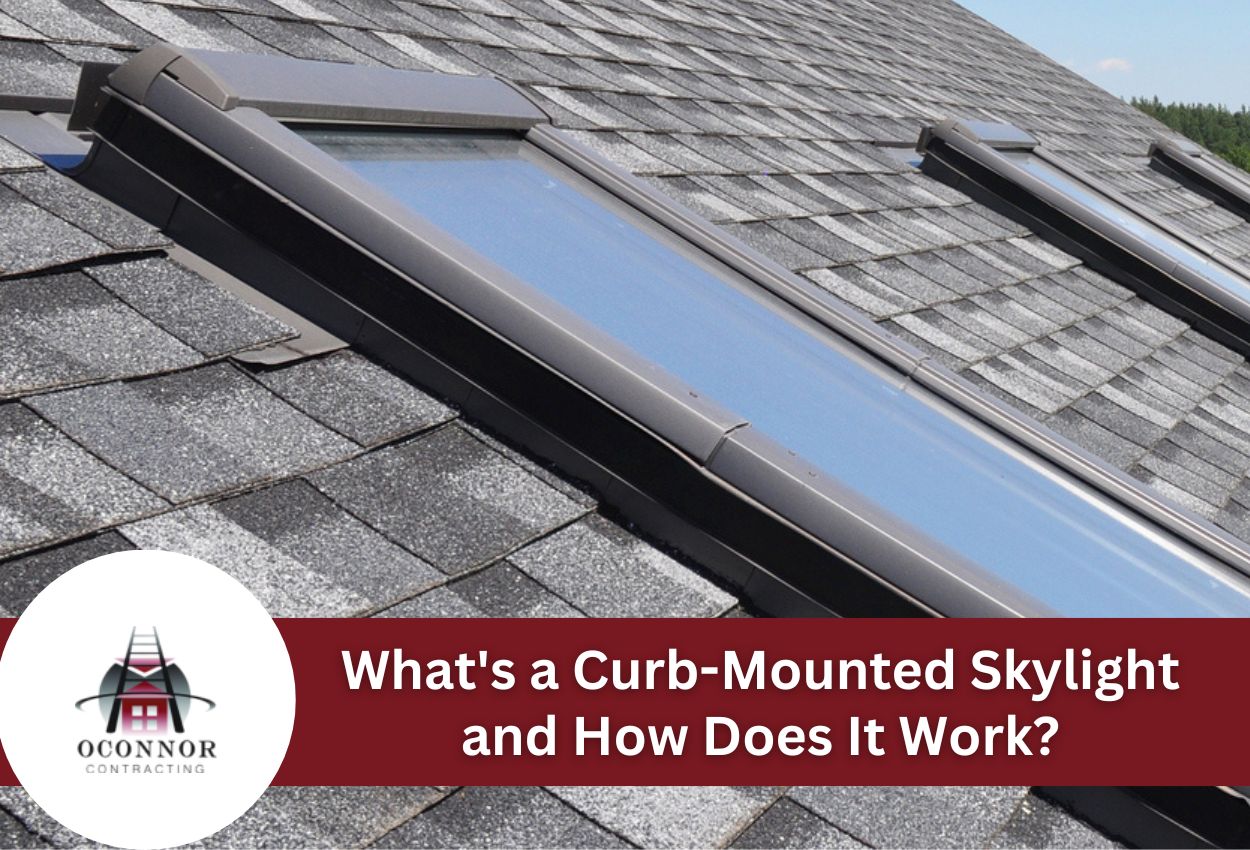 Curb-mounted skylight on a shingled roof with blue sky background